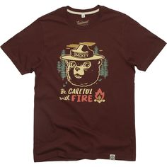 Celebrate your love for the outdoors with The Landmark Project Be Careful With Fire T-shirt  featuring the expert on fire safety himself  Smokey Bear. Red Short Sleeve T-shirt For Outdoor, Casual Red T-shirt For Outdoor Activities, Red Cotton Tops For Outdoor, Red Short Sleeve T-shirt For Outdoors, Red Crew Neck Top For Outdoor Activities, Red Tops With Graphic Print For Outdoor, Red Graphic Print Top For Outdoor, Red Cotton Tops For Outdoor Activities, Smokey Bear