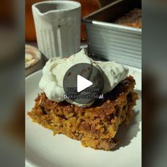 a white plate topped with cake and whipped cream