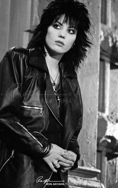 black and white photograph of a woman in leather jacket