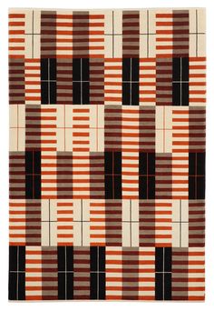 an orange, brown and black quilt with squares on it