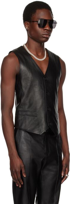 Buffed nappa lambskin vest. · Y-neck · Button closure · Welt pockets · Asymmetric hem · Satin lining Supplier color: Black Classic Leather Vest For Workwear, Luxury Black Vest For Fall, Fitted Leather Vest For Business, Classic Fitted Leather Vest, Luxury Black Notch Lapel Vest, Fitted Leather Vest Outerwear, Classic Leather Vest With Button Closure, Black Leather Vest With Pockets, Leather Vest With Button Closure