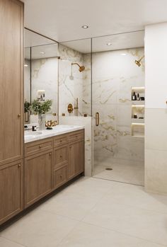 a bathroom with marble counter tops and wooden cabinets, along with a walk in shower