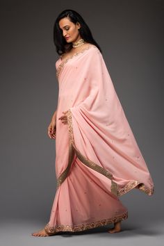 Pink saree highlighted with zardozi and mirror embroidery. Comes with cutout georgette blouse.
Components:2
Pattern:Embroidered
Type of Work:Floral
Neckline:Leaf
Sleeve Length:Sleeveless
Fabric:Georgette
Color:Pink
Other Details:
Cutout blouse
Occasion:Destination Wedding, Sangeet - Aza Fashions Eid Georgette Pre-draped Saree With Gota Work, Festive Pre-draped Saree With Gota Work, Designer Chinon Pre-draped Saree For Diwali, Bollywood Style Pre-draped Saree With Gota Work For Navratri, Georgette Pre-draped Saree With Gota Work, Pre-draped Georgette Saree With Gota Work, Art Silk Pre-draped Saree With Gota Work For Reception, Diwali Dola Silk Pre-draped Saree With Gota Work, Georgette Pre-draped Saree With Gota Work For Reception