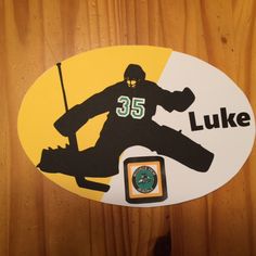 a hockey sticker with the number 35 luke on it