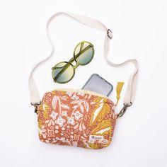 Grab your bag and head out on your next adventure! Our quilted cotton crossbody zipper bags are the perfect companion. You can wear them like a fanny pack or across the shoulder. There's an outer and inner pocket, a cotton strap with bronze hardware, and With details like a flirty tassel and custom dyed piping, these little darlings are a statement item for your journey. Color & Pattern: Golden yellow with small pink and white flowers Material: 100% premium cotton Sizing: 8.5 x 6.5 x 2.5" inches Summer Cotton Shoulder Bag With Zipper Closure, Casual Cotton Belt Bag For Everyday Use, Cotton Belt Bag With Zipper Pocket For Travel, Summer Cotton Shoulder Bag With Zipper Pocket, Trendy Cotton Shoulder Bag With Cell Phone Pocket, Casual Crossbody Camera Bag With Zipper Pocket, Summer Canvas Shoulder Bag With Zipper Pocket, Trendy Cotton Bag With Zipper Pouch, Cotton Pouch Shoulder Bag With Adjustable Strap