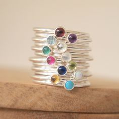 - Sterling Silver - Stackable - Your choice of Birthstones - Made to Order to Your Size - 1.5mm diameter band - 3mm Size gemstone cabochon - Gift Packaged Small Gemstone Stacking Ring featuring your choice of birthstone. A single gemstone ring featuring your birthstone in a petite 3mm size. The band of the ring is 1.5mm in diameter, making this a pretty birthstone ring simple on its own and extra beautiful combined with other rings from my collection. Why not layer a few up to keep the birthston