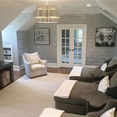 a living room filled with furniture and a flat screen tv