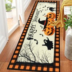 a halloween themed area rug with pumpkins and jack - o'- lanternes