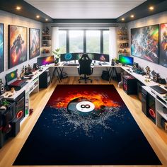 a room filled with lots of computer desks and computers on top of wooden floors