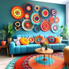 a living room filled with lots of colorful decorations on the wall above a blue couch