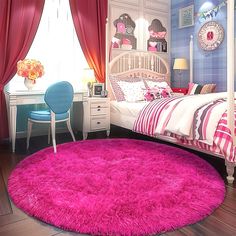 a bedroom with a pink rug on the floor