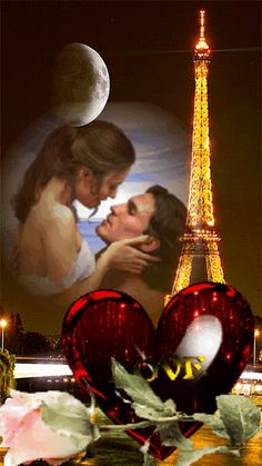 a couple kissing in front of the eiffel tower at night with rose petals