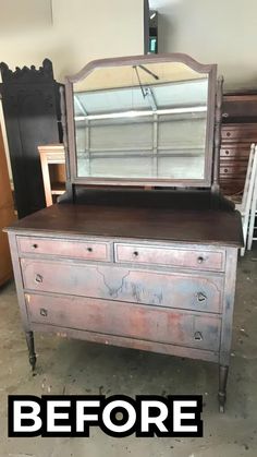 an old dresser with a mirror on top