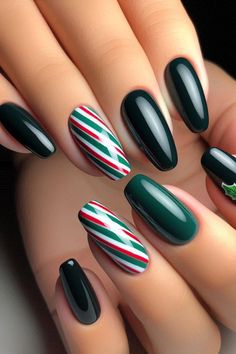 Add a unique flair to your holiday manicure with these elegant candy cane striped nails! Featuring vibrant green and red stripes with accent nails in dark green and black, this design offers a sophisticated take on festive nail art. Perfect for holiday gatherings or everyday wear, these nails are sure to make a statement. Follow our easy tutorial to recreate this stunning look and spread some seasonal cheer! 🎅✨ #NailArt #CandyCaneNails #HolidayNails #FestiveNails #NailDesigns Festive Christmas Nails Green, Christmas Nails Stripes, Red And Green Striped Nails, Green And Black Christmas Nails, Green Red Christmas Nails, Green Holiday Nail Designs, Green And Red Nails Christmas, Green Candy Cane Nails, Red White And Green Nails