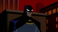 the batman animated character is standing in front of some buildings