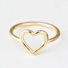 ♥ Real Gold Ring ♥A cute heart ring, perfect for somebody who likes simple and classic jewelry. The band is 10K Yellow Gold and about 1mm round. The heart itself is just under 1/2 an inch from the bottom point of the heart to the top of the heart. These are made in our studio, so we can make it any size you like :) The ring will be polished to a high mirror finish and sent in a white gift box.D E T A I L S• Made to Order in any size• Genuine 14K Gold (Rose, Yellow or White)• The thickness of app Simple Heart Shaped Promise Ring, 14k Gold Heart Ring For Everyday, Everyday 14k Gold Heart Ring, Heart Shaped Stackable Rings For Valentine's Day, Simple Heart Rings For Valentine's Day, Simple Heart-shaped Rings For Valentine's Day, Simple Heart Ring For Valentine's Day, Simple Heart-shaped Anniversary Rings, Gold Heart Ring For Valentine's Day