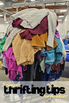 a pile of clothes sitting on top of a shopping cart with the words, 5 simple thrifting tips for pickers