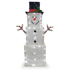 a lighted snowman standing on top of a white block with his arms spread out