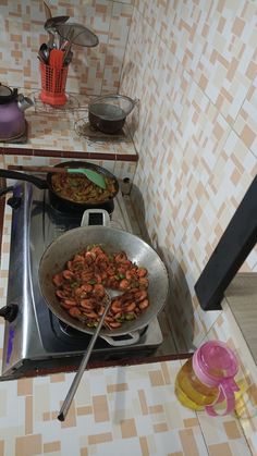 a stove top with some food cooking on it