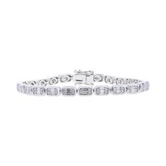 Make a statement with the Jacques Bezel Diamond Bracelet. This elegant bracelet features 1 1/2 carats total weight of baguette cut and round brilliant diamonds blended together and set in 14 karat gold, adding a touch of art deco flair to any outfit. Luxury Diamond Bracelet With Bezel Setting For Engagement, Luxury White Gold Bracelet With Bezel Setting, Baguette Diamond Bracelet, Elegant Bracelet, Baguette Cut, Bezel Diamond, Baguette Diamond, Top Gifts, Brilliant Diamond