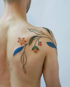 a man with a flower tattoo on his back