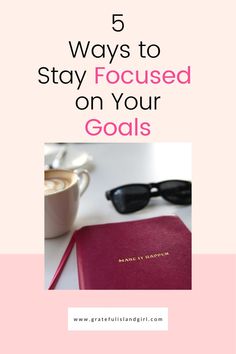 a pink book with the title 5 ways to stay focused on your goals, including coffee and sunglasses