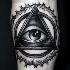 an all seeing eye tattoo on the leg