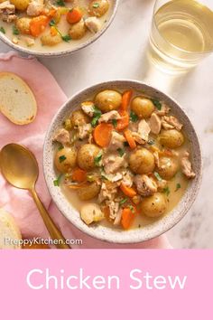 two bowls of chicken stew with bread on the side