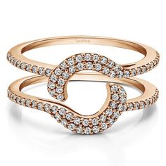 a rose gold ring with diamonds on the band and an intertwined heart in the middle