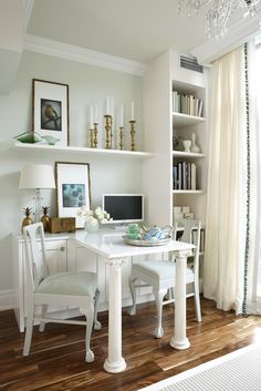 a white desk and chair in a room