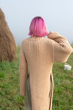 "Stylish asymmetric sweater with extra long wide sleeves. Made with soft wool blend yarn. Materials: Wool / Acrylic Color of the modeled sweater: honey Measurements (size S): Width (from underarm to underarm): 18,5\" = 46 cm Length: 46\" = 117 cm Sleeve length (shoulder to wrist): 26\" = 66 cm Measures of Model in the photo Size: S Chest: 32\" - 82 cm Weist: 24\" - 62 сm Hip: 34\" - 88 cm Height: 66\" - 170 cm CARE INSTRUCTIONS: DRY CLEAN is the best way. HAND WASH. Make sure to use cold water a Long Chunky Knit Sweater, Long Knit Sweater For Fall, Knit Cropped Sweater For Winter, Winter Cropped Knit Sweater For Layering, Winter Layering Cropped Sweater In Knit Fabrication, Oversized Knitted Cropped Sweater For Layering, Winter Cropped Sweater With Knit Fabrication For Layering, Winter Cropped Sweater For Layering With Knit Fabrication, Oversized Merino Wool Knit Sweater