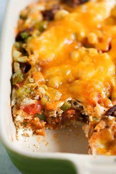 a casserole dish with meat, cheese and veggies in it on a table