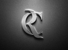 the letter r is made up of silver metal and has a curved design on it