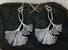 "These are pretty and eye catching ginkgo biloba leaf earrings. They have incredible detail and design. They are known for there powerful herbal properties and are also simply exquisite to look at at! The earrings measure 1 5/8\" long by 1 1/4\" wide. They hang from simple silver ear wire hooks. Overall drop length is 1 3/4\". Made from plated silver. I can make a matching necklace if you would like the whole set. Just send me a convo and I will make it happen! Thanks for stopping by! Please tak Gingko Earrings, Ginkgo Earrings, Herbal Properties, Gingko Biloba, Boho Hoop Earrings, Gingko Leaves, Hammered Hoop Earrings, Sunflower Earrings, Big Hoop Earrings