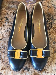 This listing is for a pair of preowned Salvatore Ferragamo blue with gold trim soft grain leather Vara flats.  It has the gold logo Hardware buckle and blue and gold bow. Almond shaped toes and is a size 8B. Made in Italy. Formal Leather Heels With Gold Buckle, Vintage Pumps, Black Leather Pumps, Blue Pumps, Gold Logo, Gold Leather, Leather Pumps, Blue Leather, Women's Pumps