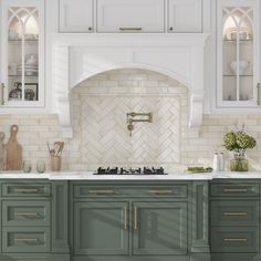 a kitchen with green cabinets and white counter tops