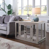 a living room scene with focus on the couch and coffee table in front of the window