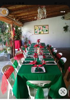 the table is set with green and red linens