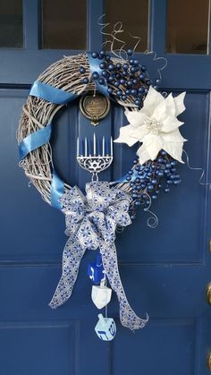 a blue door with a wreath on it