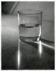 a glass filled with water sitting on top of a table next to a shadowless wall