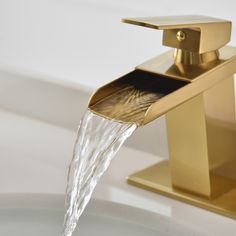 a golden faucet with water running from it