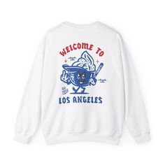 Show your team spirit with our Los Angeles Dodgers Graphic Sweatshirt!  Perfect for devoted Dodgers baseball fans, this super comfortable sweatshirt features a stylish Los Angeles design that stands out at the game or while lounging at home. Available in a variety of colors and sizes. Made from high-quality materials, this sweatshirt provides the perfect blend of warmth and breathability, making it ideal for any season. Whether you're cheering from the stands or hanging out with friends, this sweatshirt is a must-have addition to your fan gear collection. Grab yours today and support the Dodgers in style! .: Made with a medium-heavy fabric blend of 50% cotton and 50% polyester (8.0 oz/yd² (271.25 g/m this sweatshirt feels cozy and is the perfect choice for those colder months. .: The class College Baseball Jersey With Team Logo And Crew Neck, Sports Fan Cotton Baseball Jersey With Team Logo, Collegiate Baseball Jersey With Crew Neck For Sports Season, Collegiate Style Baseball Jersey With Crew Neck, Collegiate Style Crew Neck Baseball Jersey For Sports Season, Long Sleeve T-shirt With Team Logo For Streetwear, College Crew Neck T-shirt With Letter Print, Team Spirit Baseball Jersey With Crew Neck For College, College Baseball Jersey With Crew Neck