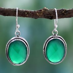 Shanker designs earrings in a luscious shade of green. Heat-treated and faceted onyx rests on sterling silver bezels in earrings that are crafted by hand in India. .925 Sterling silver