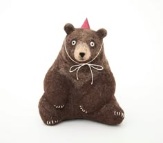 a stuffed bear with a party hat on