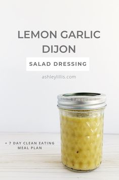 a glass jar filled with lemon garlic dijon