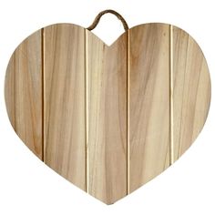 a heart shaped wooden cutting board on a white background