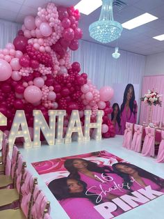 a room filled with pink and white balloons that spell out the name shanah on it