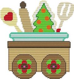 a cross stitch christmas tree in a wagon with spoons and spatulas on it