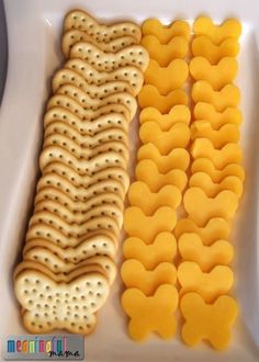 some crackers and cheese are on a white plate