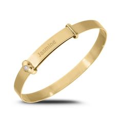 Celebrate your favorite little girl with this beautiful Personalized bangle bracelet. Crafted in warm 10K gold, this darling look features the name of your choice - up to ten characters in length - inscribed in a print font. Gleaming collars flank the center design, one topped with a sparkling diamond accent centered in a sculpted heart shape. The final sweet touch: the inscription "Baby’s First Diamond" glistens on the opposite side. Polished to a bright shine, this bracelet adjusts between 4.7 Baby Jewelry, Sparkling Diamond, Cartier Love Bracelet, Nursery Ideas, Sparkle Diamonds, Diamond Stone, Diamond Clarity, 10k Gold, Stone Settings